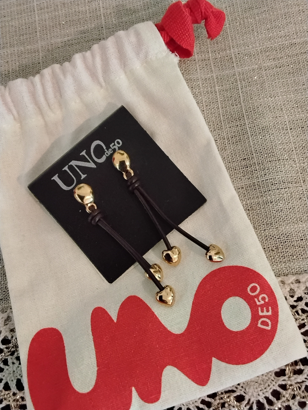 UNO de 50 Gold Heart Drop Earrings with Black Leather Cord